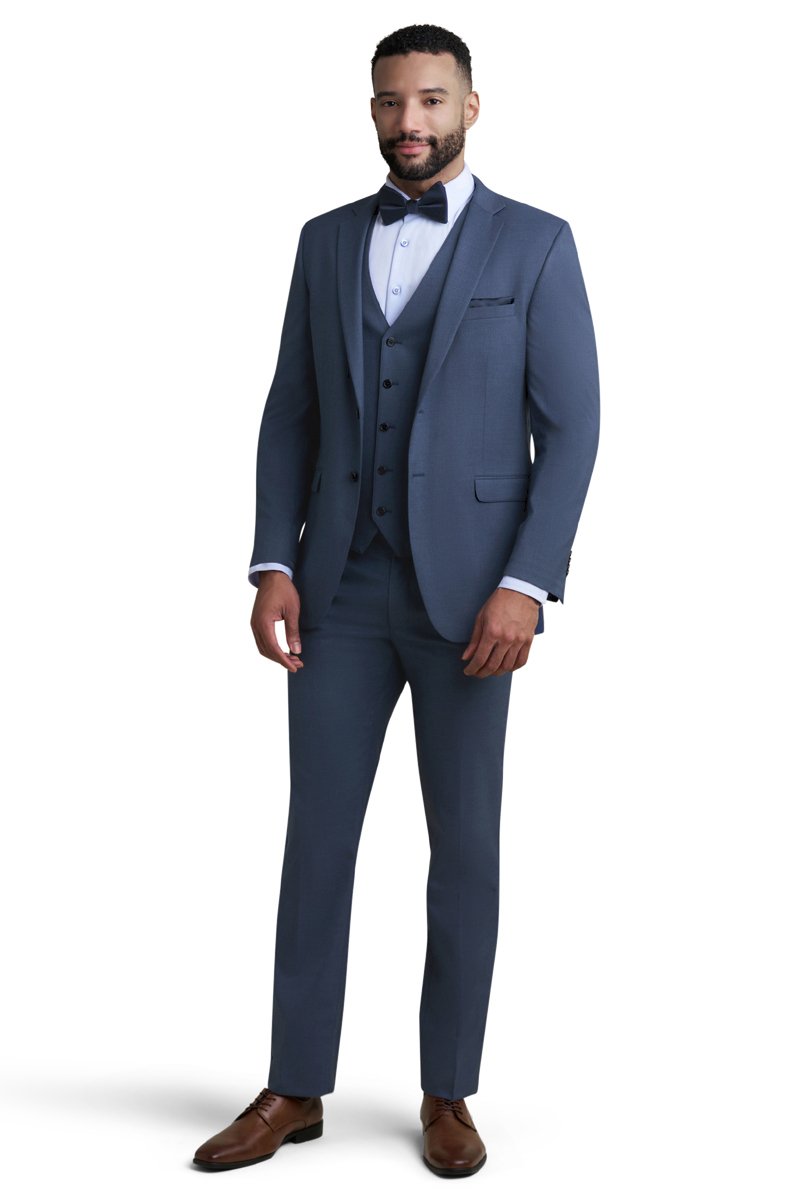 blue 3 piece suit with a light blue shirt and a navy bow tie