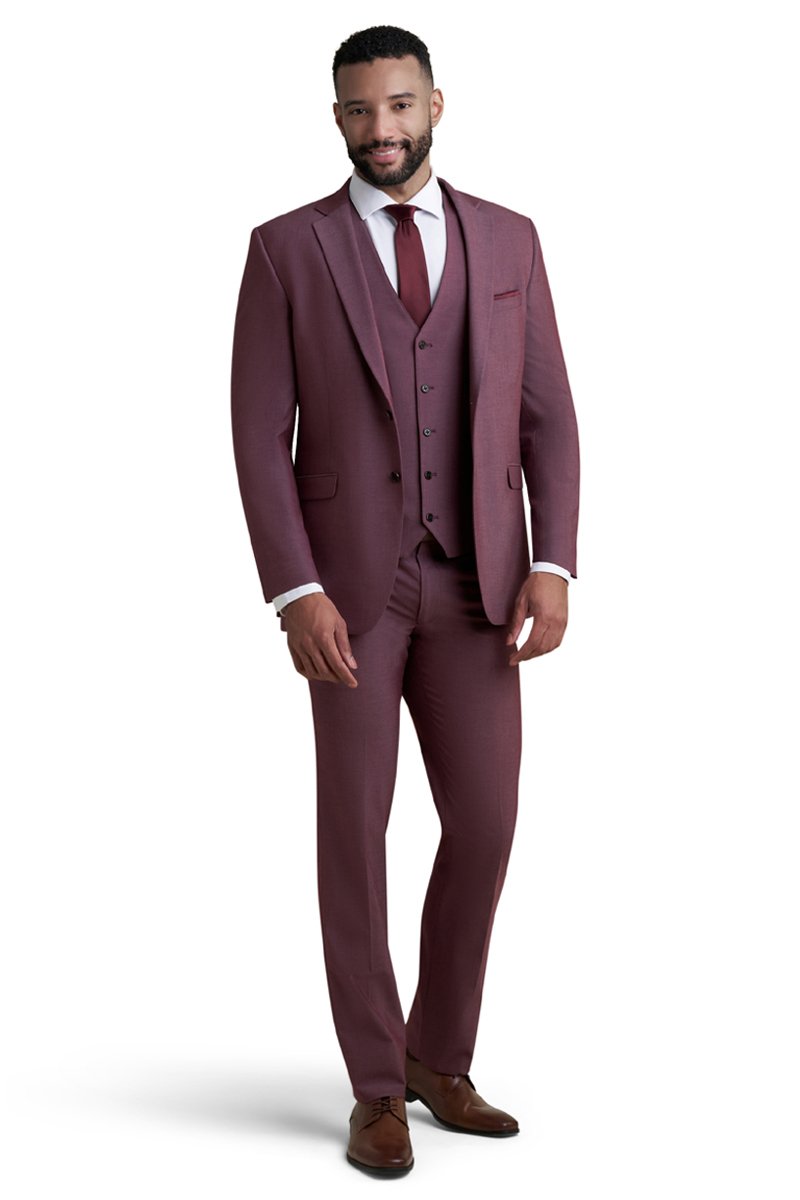 burgundy stretch suit worn with a white shirt and a wine color long tie