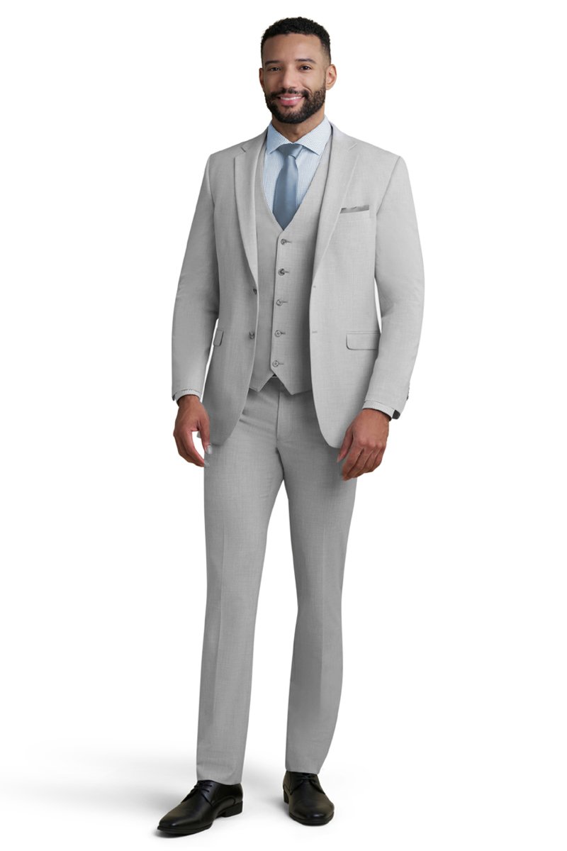 light grey stretch suit worn with a blue geometric shirt