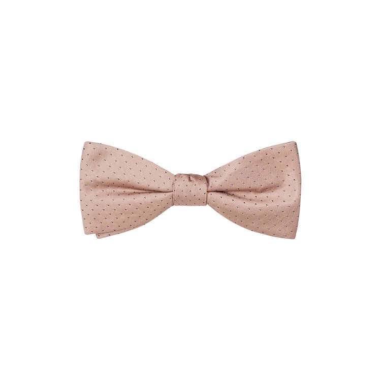 A tan color bow tie with white pin dots made from silk fabric